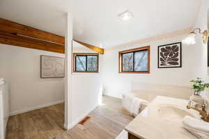Bathroom with vanity and light wood finished floors