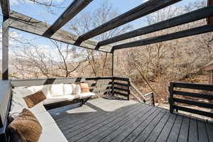 Wooden terrace featuring an outdoor lounge area