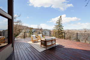 Wooden deck with an outdoor lounge area