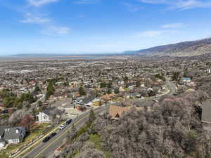 Aerial perspective of suburban area featuring a mountainous background