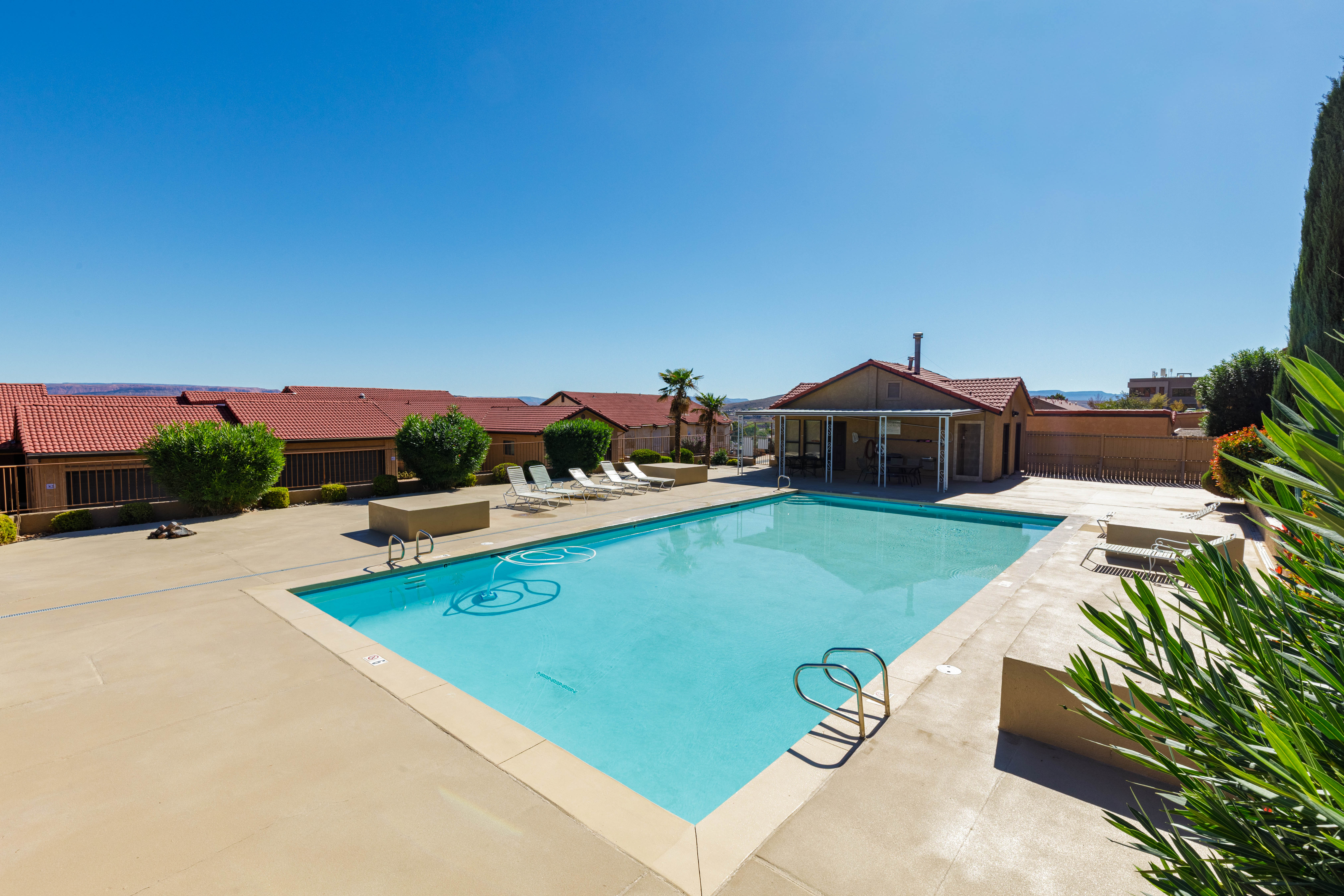 Community pool with a patio area