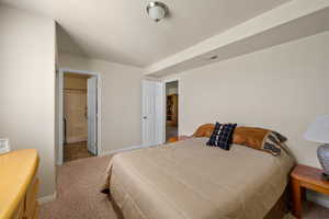 Bedroom featuring carpet flooring and ensuite bath