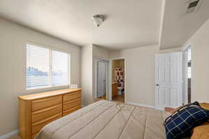 Bedroom with connected bathroom and a closet