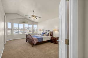Master Bedroom with light colored carpet and a ceiling fan