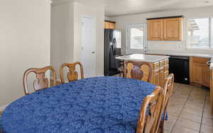 Dining room featuring baseboards and light tile patterned floors