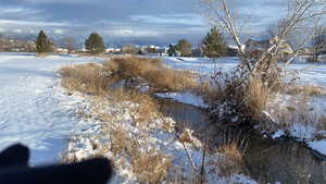 Water view featuring nearby suburban area