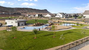 View of community with a residential view, a patio area, and a mountain view