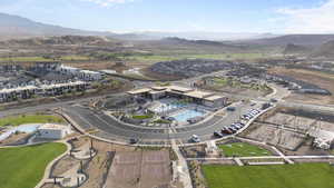 Aerial perspective of suburban area featuring a mountain backdrop