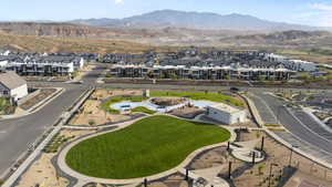 Aerial perspective of suburban area with a mountain backdrop