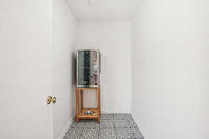 Spare room featuring baseboards and beverage cooler