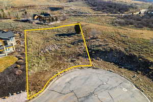 Aerial view of property and surrounding area with property parcel outlined