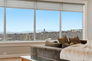 Bedroom with a view of city and a mountain view