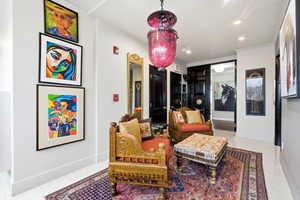 Sitting room featuring recessed lighting and crown molding