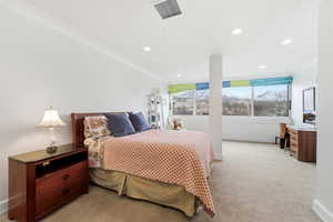 Bedroom featuring ornamental molding, light carpet, a mountain view, and recessed lighting