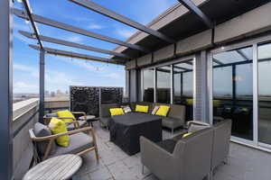 View of patio / terrace featuring an outdoor hangout area and a view of city
