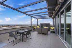 View of patio / terrace featuring an outdoor living / dining area