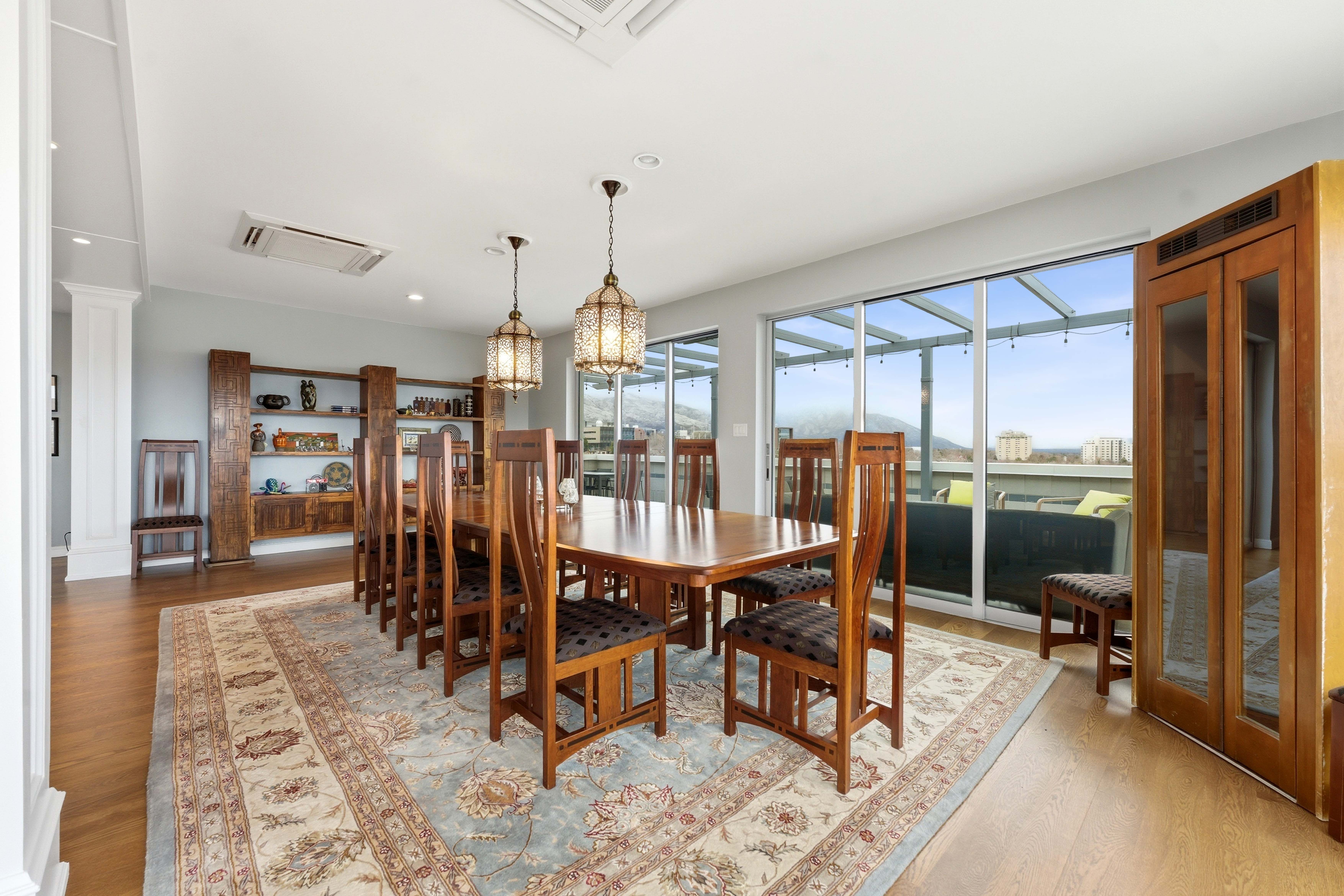 Dining room featuring wood finished floors and suspended lighting