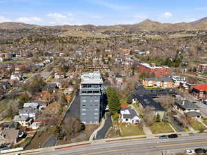 Aerial overview of property's location featuring a mountainous background