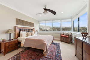 Bedroom featuring light carpet, crown molding, ceiling fan, and recessed lighting