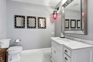 Bathroom with vanity and light tile patterned flooring