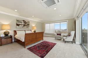 Bedroom featuring recessed lighting, crown molding, and light carpet
