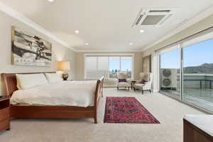 Bedroom with crown molding, light colored carpet, recessed lighting, and access to exterior