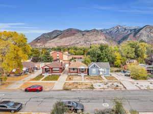 Aerial view of residential area featuring a mountainous background