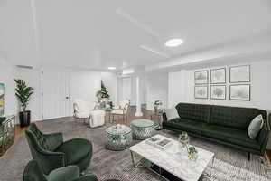 Living area with recessed lighting and wood finished floors