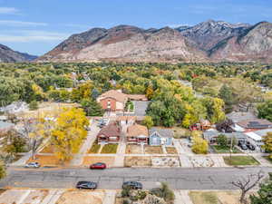 Aerial perspective of suburban area featuring a mountain backdrop
