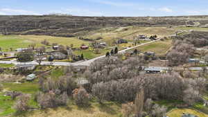Aerial view of property and surrounding area with rural landscape