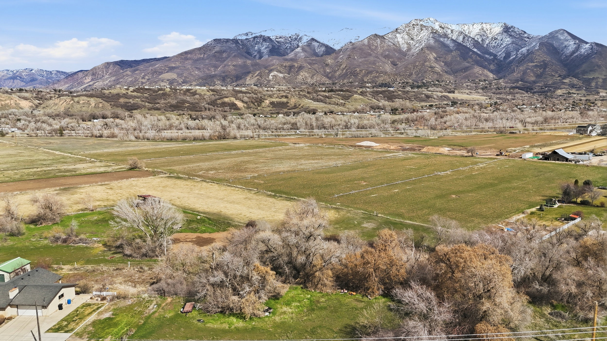 View of mountain backdrop with rural landscape