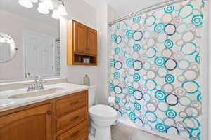 Full Bathroom – Well-appointed bathroom with a vanity offering storage, bright lighting, and a full tub and shower combination.