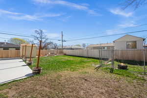 Fenced backyard with a gate