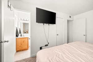 Bedroom with light tile patterned flooring