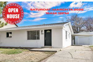 View of front of house with brick siding, concrete driveway, a shingled roof, and a garage