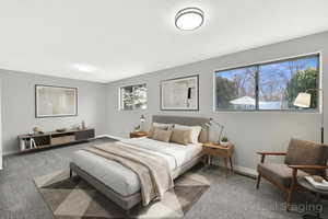 Bedroom with baseboards and carpet