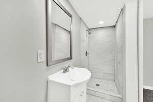 Bathroom featuring vanity, a shower stall, and recessed lighting