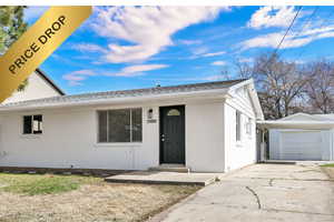 Single story home with brick siding, concrete driveway, a garage, and a shingled roof