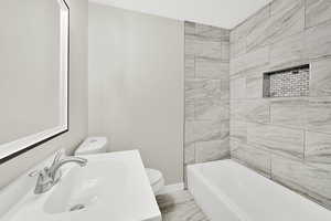 Full bath featuring toilet and vanity