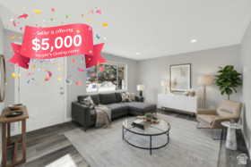 Living area with wood finished floors and recessed lighting