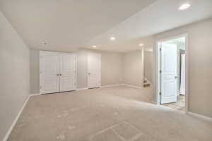 Finished basement featuring carpet flooring and recessed lighting