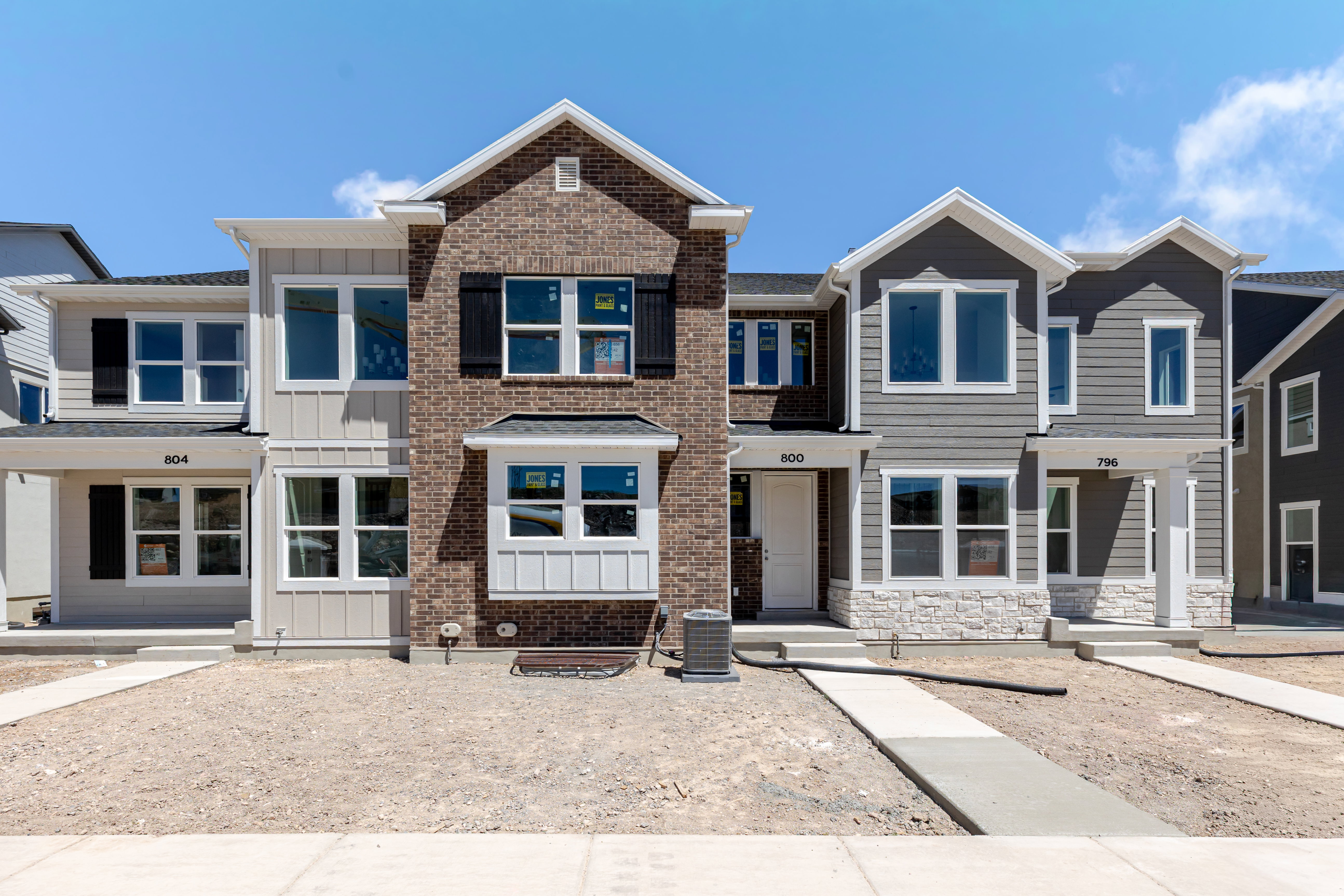 Contemporary multi-unit dwelling with brick and siding exteriors