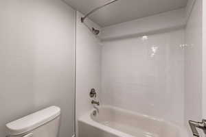 Full bath with toilet and  shower combination