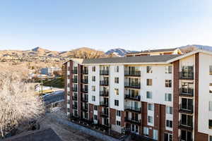View of apartment building / complex featuring a mountain view