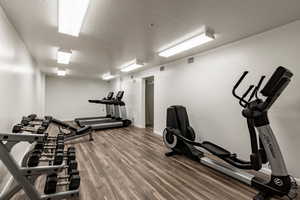 Workout area featuring a textured ceiling