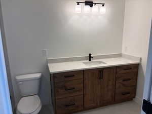 Bathroom with vanity and toilet
