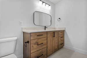 Half bath with toilet and vanity