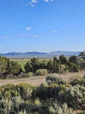 View of mountain backdrop featuring rural landscape