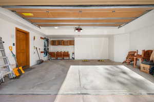 Garage featuring a garage door opener