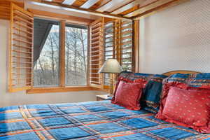 Bedroom with wallpapered walls